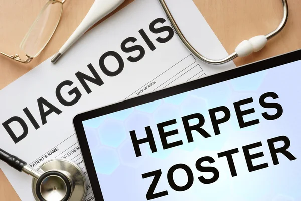 Tablet with diagnosis herpes zoster and stethoscope.