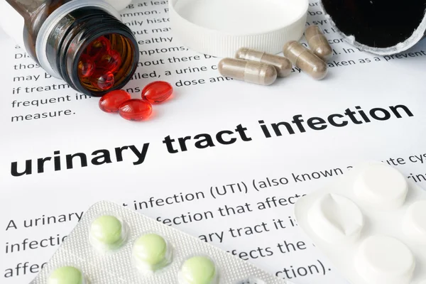 Paper with urinary tract infection  and pills.