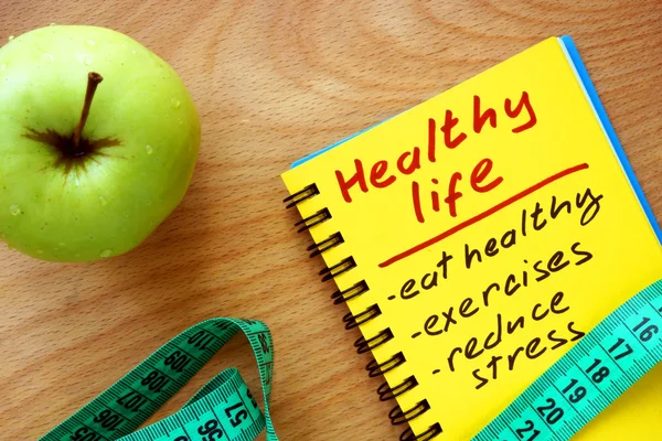 Notepad with healthy life guide, apple and measure tape