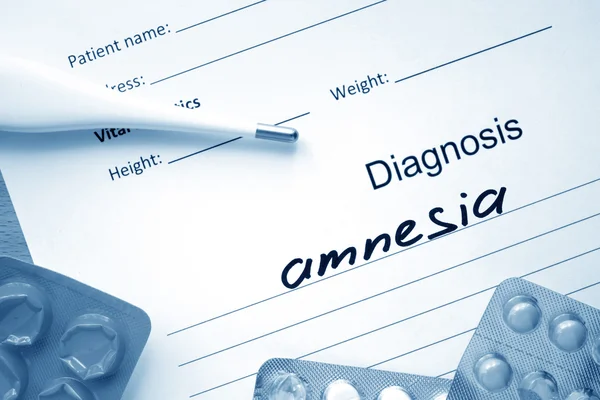 Diagnostic form with diagnosis Amnesia and pills.
