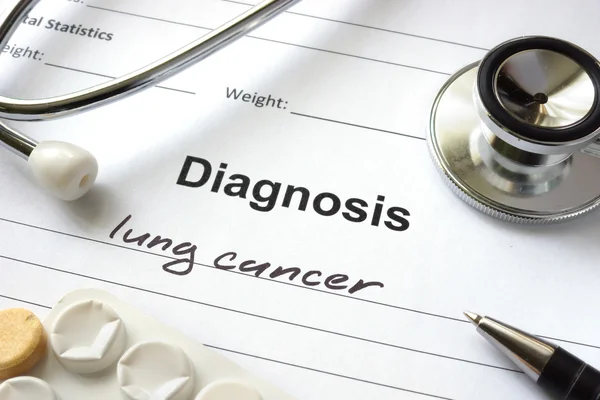 Diagnosis lung cancer written in the diagnostic form and pills.