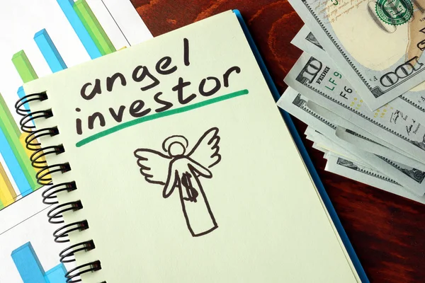 Notebook with angel investors  sign.  Business concept.