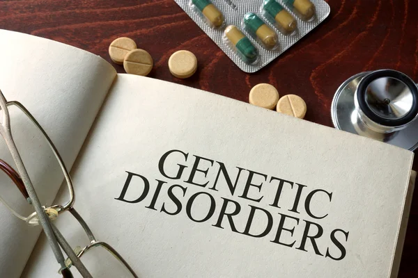 Book with diagnosis genetic disorders and pills.