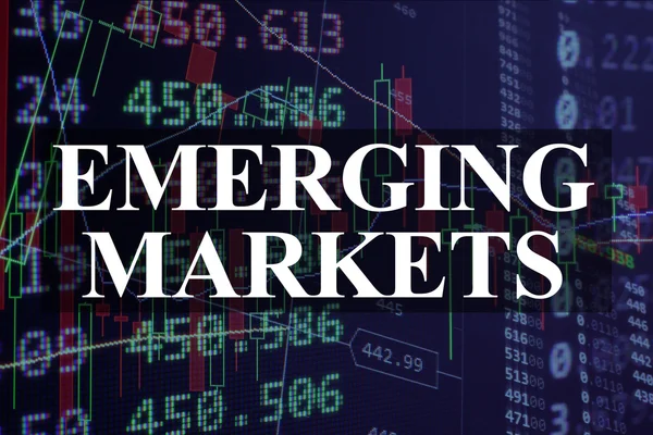 Words emerging markets  with the trading data on the background.