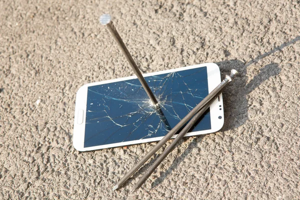 Composition of metal nail and smartphone