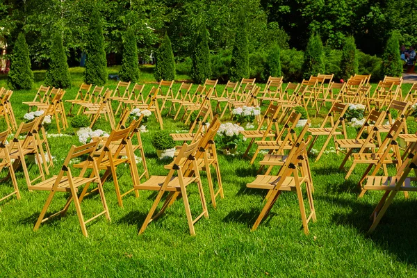 Rows of brown folding chairs
