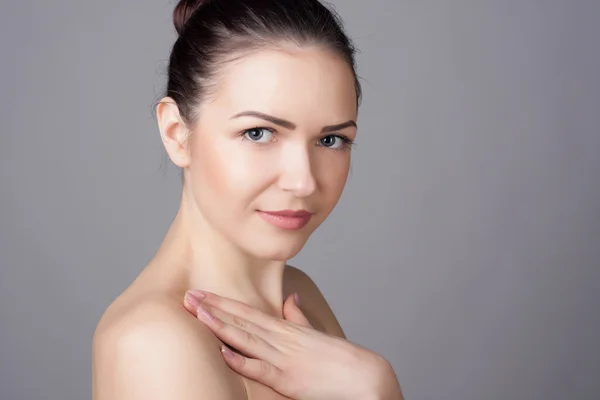 Close-up portrait of a beautiful young woman. Skin care concept. Natural look. Beauty portrait. Spa and health.