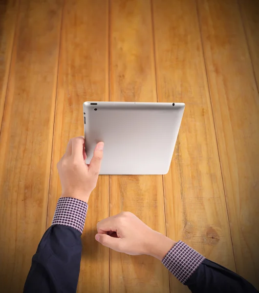 Hands holding and pointing on contemporary digital tablet