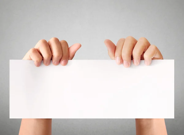 Holding white empty paper