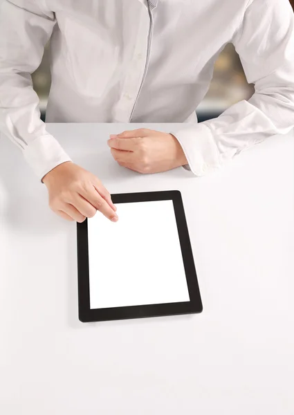 Hands holding and pointing on contemporary tablet