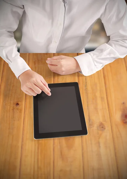 Hands holding and pointing on contemporary tablet