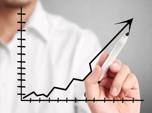 Man hand drawing a chart