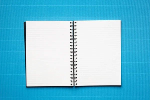 Open book with lines  on a blue crepe paper background