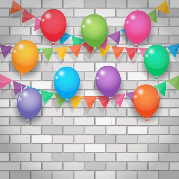 Balloon and party flags on brickwall background