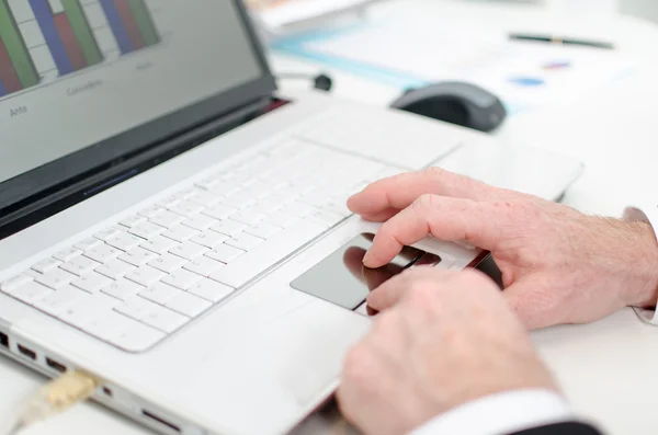 Businessman using a laptop mouse