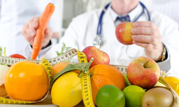 Doctor nutritionist with healthy fruits