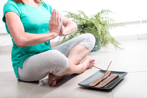 Woman doing yoga at home