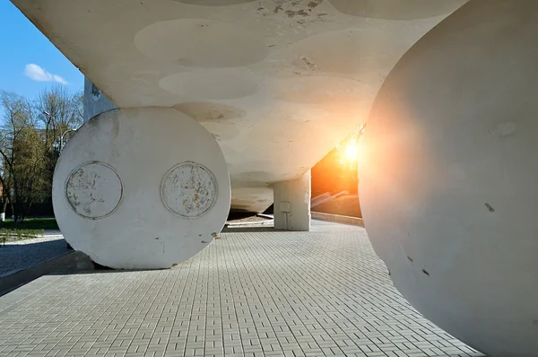 Urban modern architecture ensemble - stone ball and hemisphere, holding up the sloping shaped ceiling