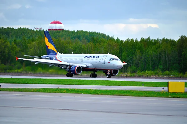 Donavia Airbus A319-111 airplane rides on the runway after landing in Pulkovo International airport in Saint-Petersburg, Russia