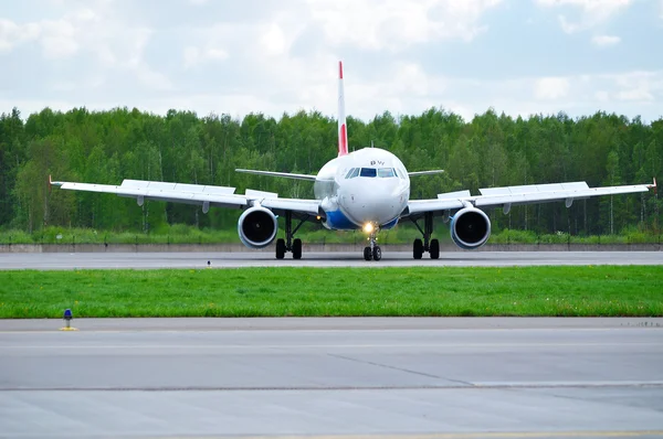 Austrian Airlines Airbus A320 aircraft is riding on the runway after landing at Pulkovo International airport in Saint-Petersburg, Russia