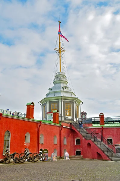 Flag Tower with Russian Navy flag and Naryshkin Bastion on the territory of Peter and Paul Fortress in Saint-Petersburg, Russia