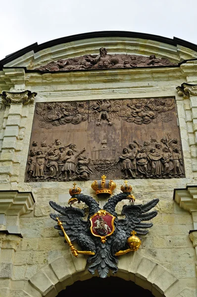 Sculpture of double-headed eagle in imperial crown and Bas-relief \