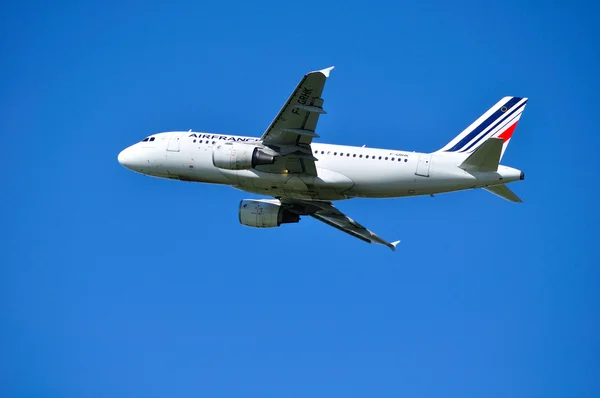 Air France Airbus A319 aircraft is flying in the sky after departure from Pulkovo International airport in Saint-Petersburg, Russia