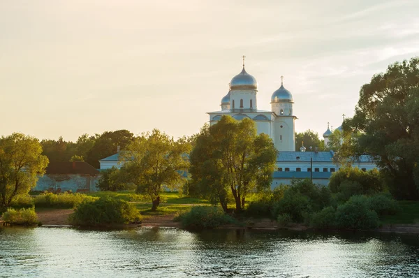 Yuriev male monastery on the bank of the Volkhov river at sunset in Veliky Novgorod, Russia - architecture summer landscape