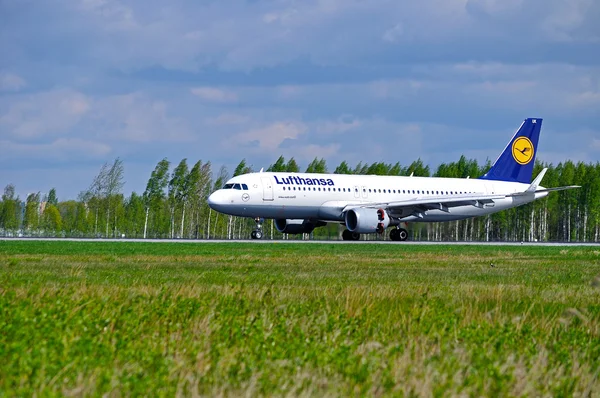 Lufthansa Airbus A320 aircraft is arriving in Pulkovo International airport in Saint-Petersburg, Russia
