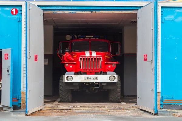 Fire truck standing in the hangar at fire department of Veliky Novgorod, Russia