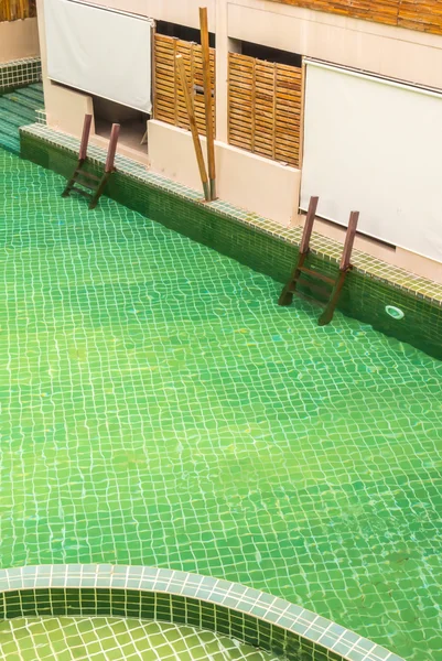Green swimming pool.