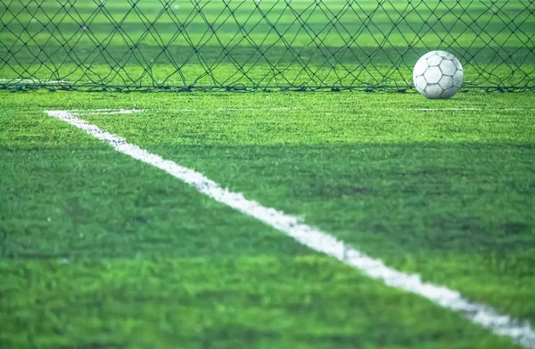 Football on field line.