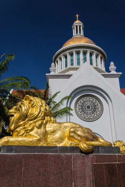 Gold lion statue  in front of  church