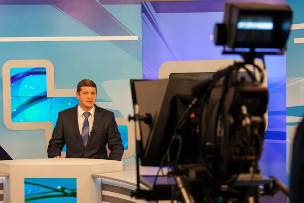 Tv studio camera recording male reporter or anchorman. Live broadcasting