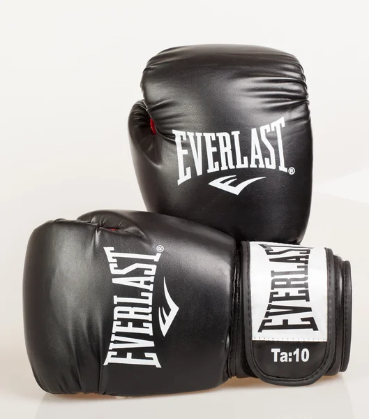 Varna , Bulgaria - DECEMBER 17, 2013: Everlast black boxing gloves.Everlast is an American brand. Based in Manhattan, Everlast\'s products are sold in more than 75 countries. Product shot