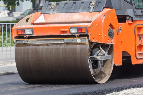 Heavy Vibration roller compactor at asphalt pavement works for road repairing