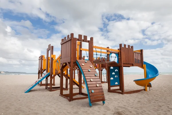 Children playground on the beach. Slide and climbing frames