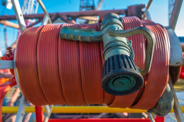 Fire hose at oil and gas rig helipad