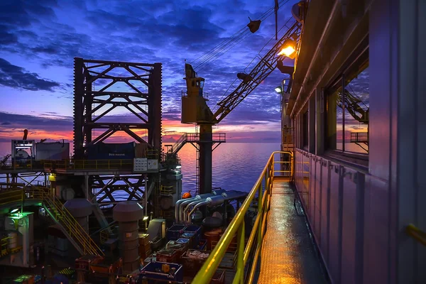 Jack up oil rig with twilight sky