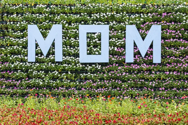 MOM label on flowers bakground