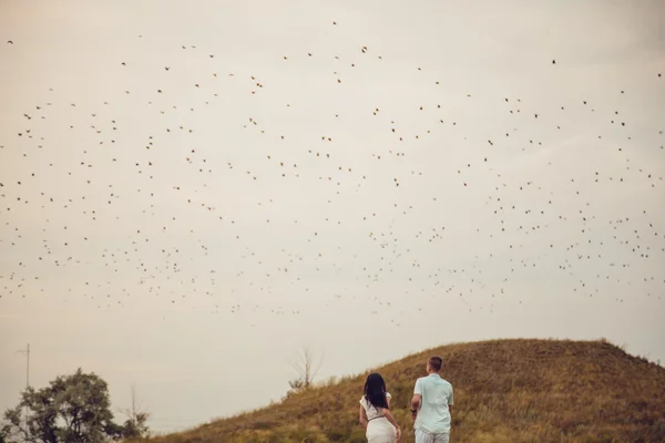 Love story. Silhouette figures of people in love on the nature. Screensaver for the film.