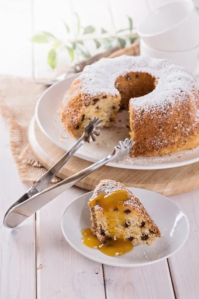 A piece of Bundt cake with fruit topping