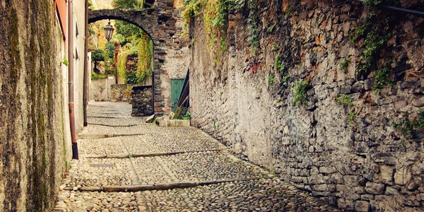 Deserted medieval street - vintage effect. Varenna, Como lake, Italy.