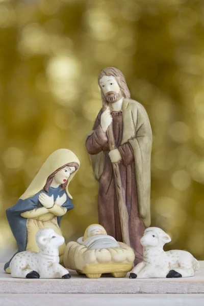 Nativity Scene on Golden Background with Copy Space