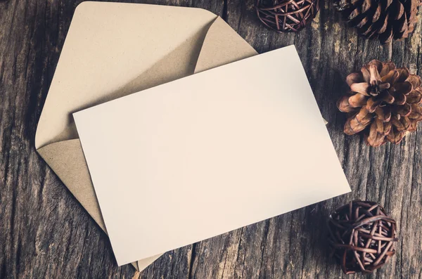 Blank white paper card with brown envelop