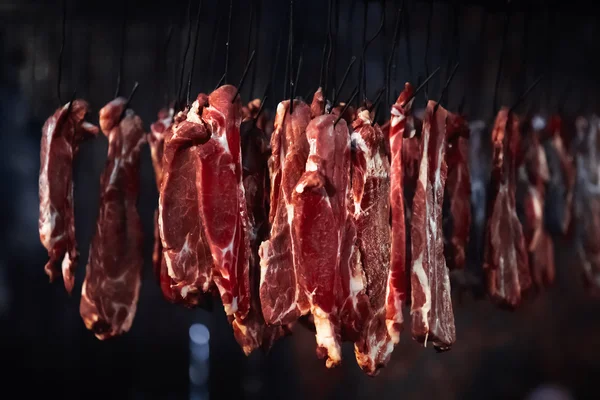 Meat in a smokehouse  on background