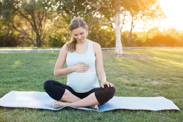 Pregnant yoga outside