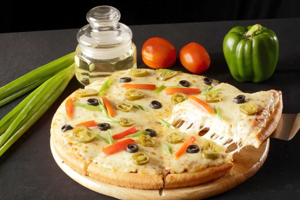 Delicious Vegetable cheese pizza.