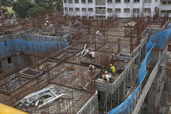 Bangalore, Karnataka, India - September 15, 2010: Unidentified workers are employed in construction overhead metro in bangalore City