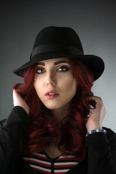 Portrait of a beautiful woman wearing a hat